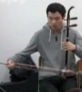 Music3 Man playing an instrument