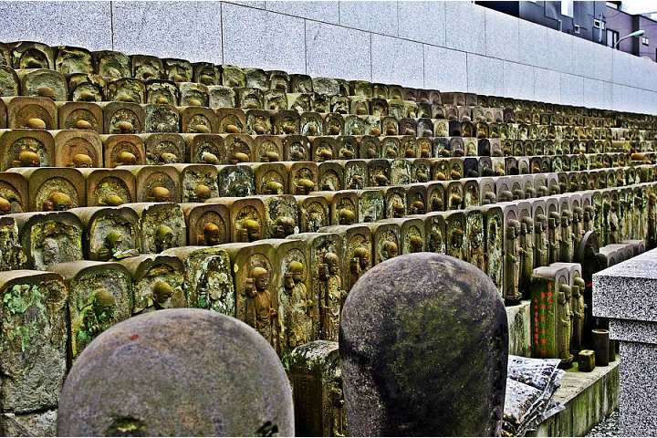 A thousand Buddha statues in a temple graveyard just outside of Ueno Park
