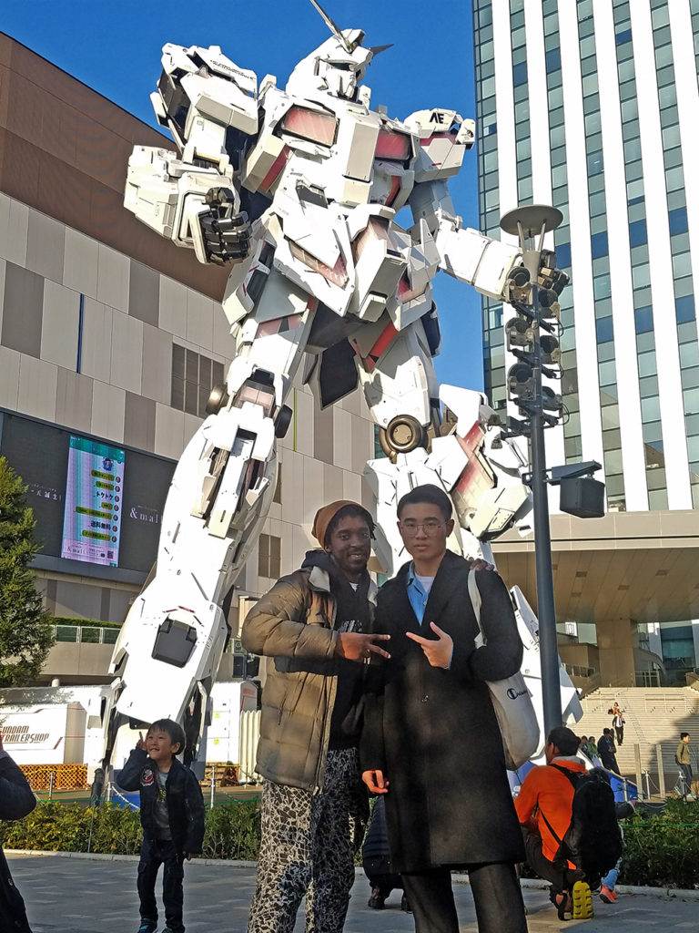 KCP students in front of the Gundam statue