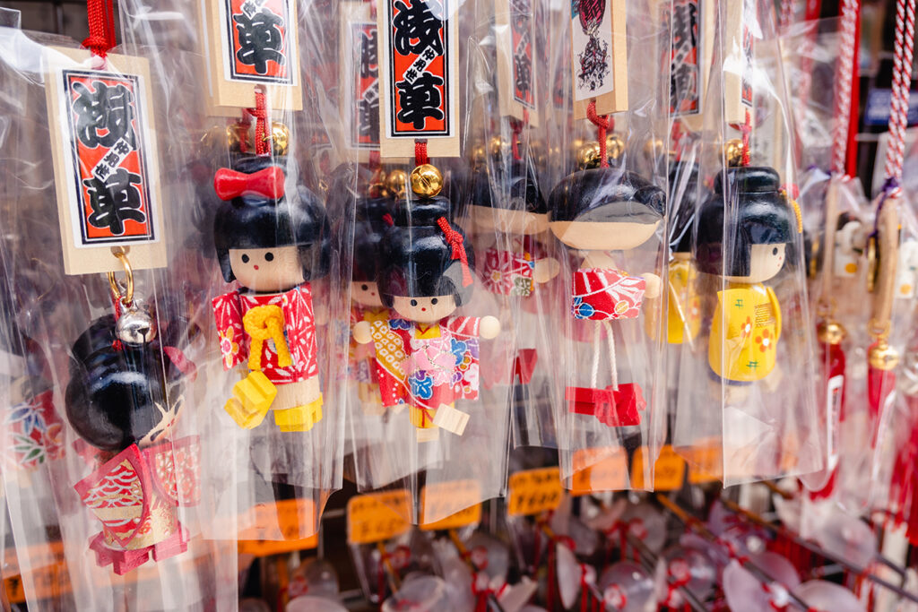 July 2022 - Tokyo, Japan: Japanese wooden doll, famous souvenir sold at Asakusa Sensoji Temple.